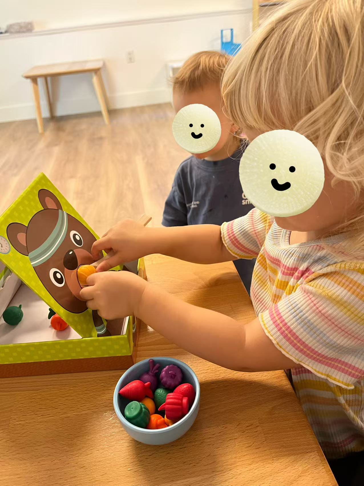 Children practicing fine motor play with toy fruits and vegetables at Forest Cubs Childcare